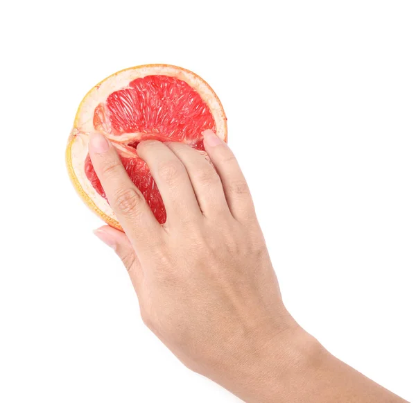 Молодая женщина трогает половину грейпфрута на белом фоне, вид сверху. Сексуальная концепция — стоковое фото
