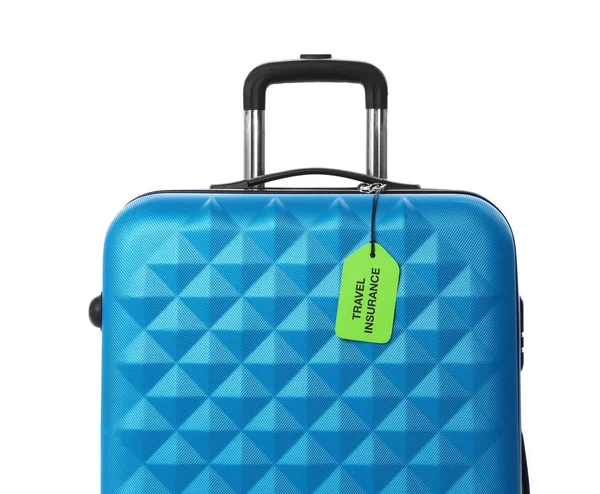Valigia blu con etichetta TRAVEL INSURANCE su sfondo bianco — Foto Stock