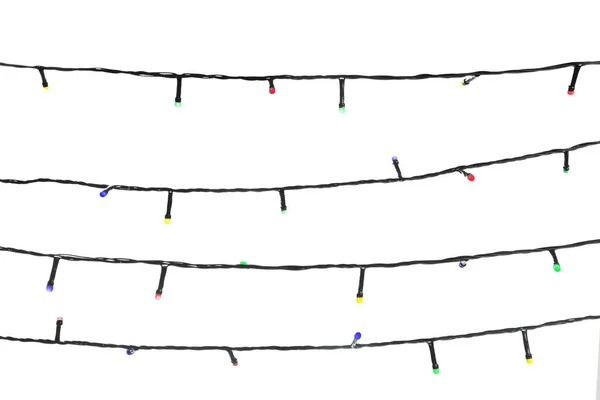 Strings of Christmas lights on white background