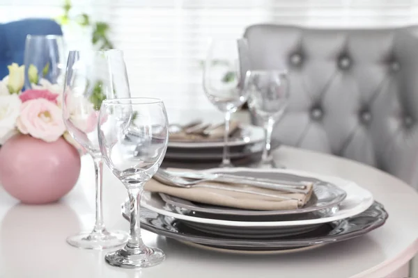 Beautiful table setting in modern dining room interior — Stock Photo, Image