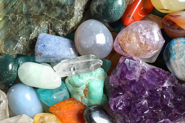 Different beautiful gemstones as background, top view — Stock Photo, Image