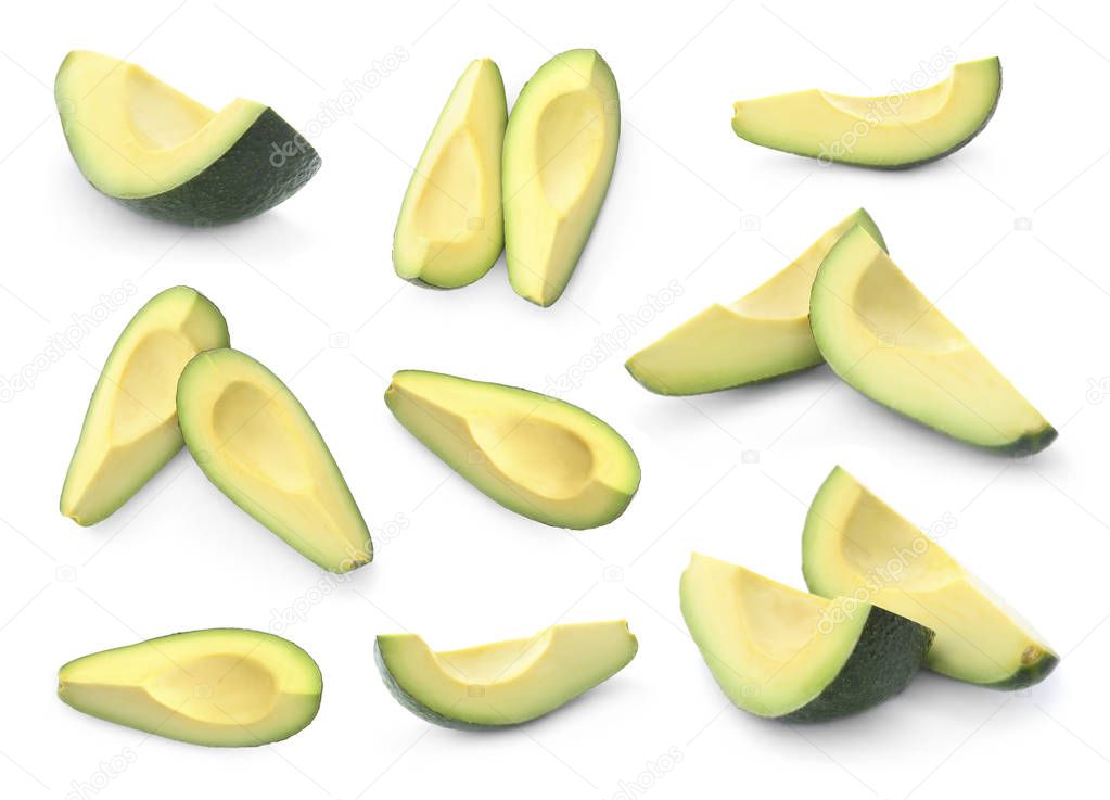 Set of cut fresh ripe avocados on white background