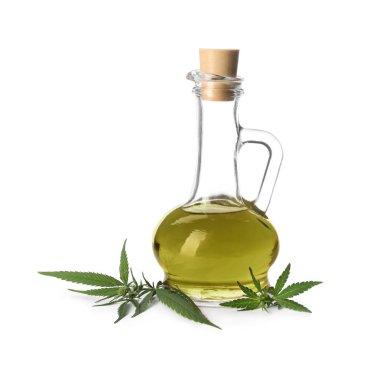 Kenevir yağı ile Jug ve beyaz arka plan üzerinde yaprakları