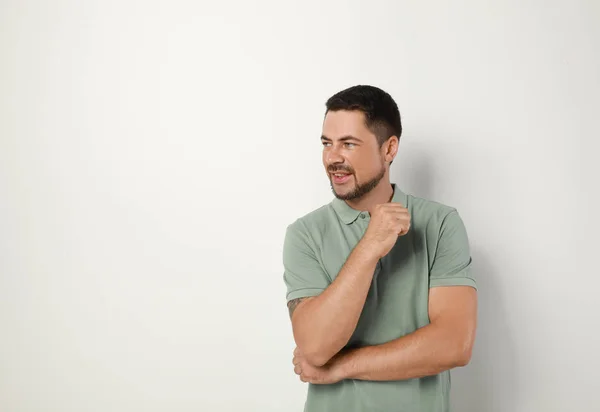 Portrait of handsome man on light background. Space for text — Stock Photo, Image