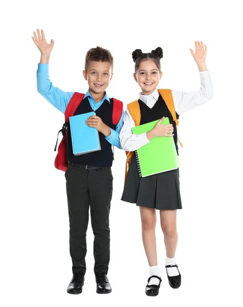 Niños felices en uniforme escolar sobre fondo blanco —  Fotos de Stock