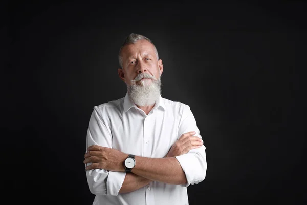 Portrait of handsome senior man on black background — Stock Photo, Image