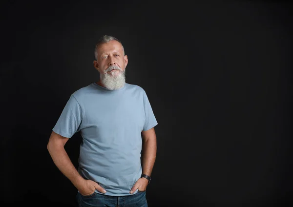 Portrait of handsome senior man on black background — Stock Photo, Image