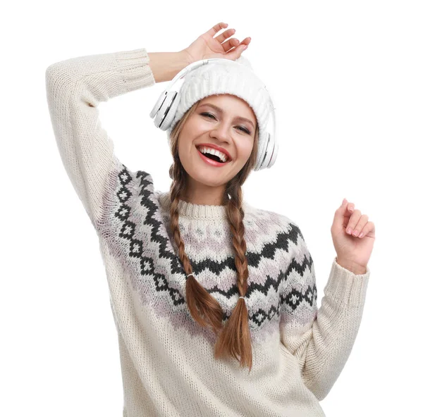 Young woman listening to music with headphones on white background — Stock Photo, Image