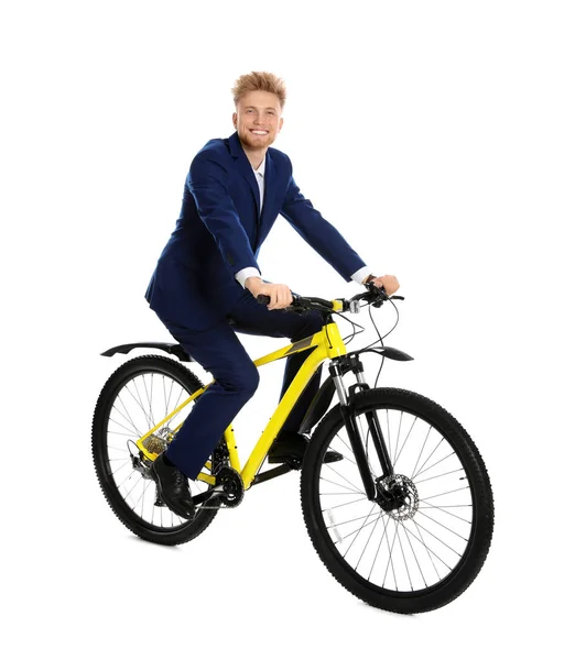 Mladý obchodník jedoucí na kole na bílém pozadí — Stock fotografie