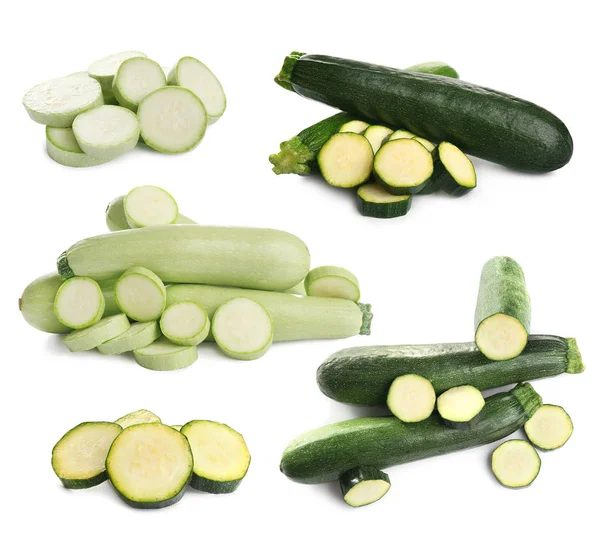 Set van verse rijpe courgettes op witte achtergrond — Stockfoto