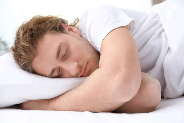 Handsome young man sleeping on pillow at home. Bedtime — Stock Photo, Image