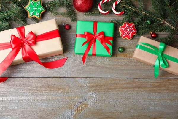 Flat lay composition with Christmas gifts on wooden background. Space for text — Stock Photo, Image