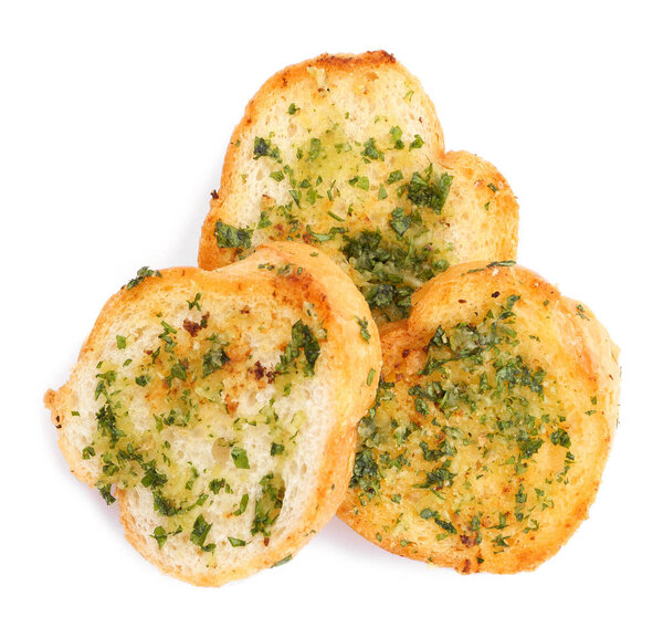 Slices of toasted bread with garlic, cheese and herbs on white background, top view