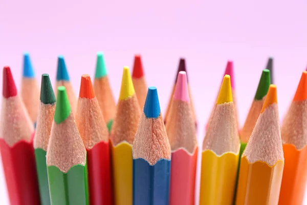 Different color pencils on lilac background, closeup — Stock Photo, Image
