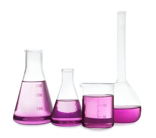 Laboratory glassware with purple liquid on white background — Stock Photo, Image