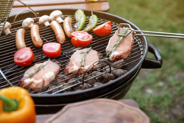 Cooking food on barbecue grill outdoors, closeup — Stock Photo, Image