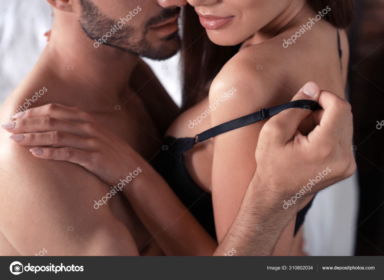 Passionate young couple having sex on bed at home, closeup Stock Photo by ©NewAfrica 310802034 image