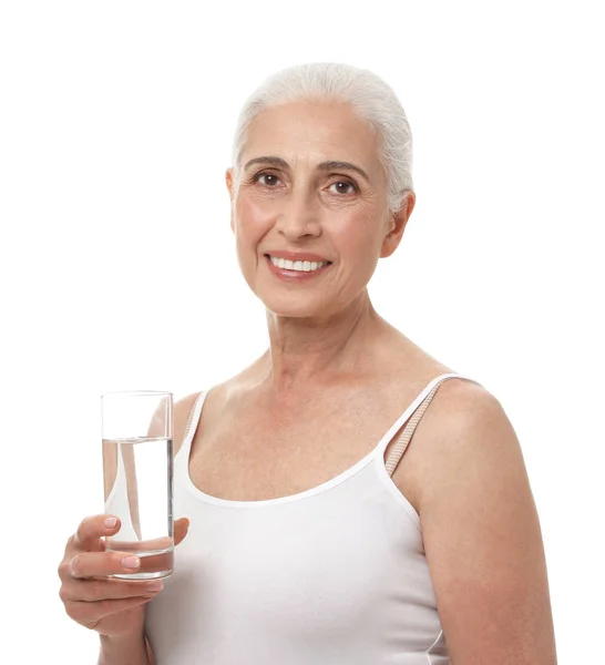 Portrait of beautiful matre woman with glass of water on white background — Stok Foto