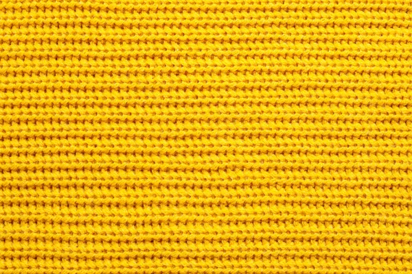 Gele wintertrui als achtergrond, close-up view — Stockfoto