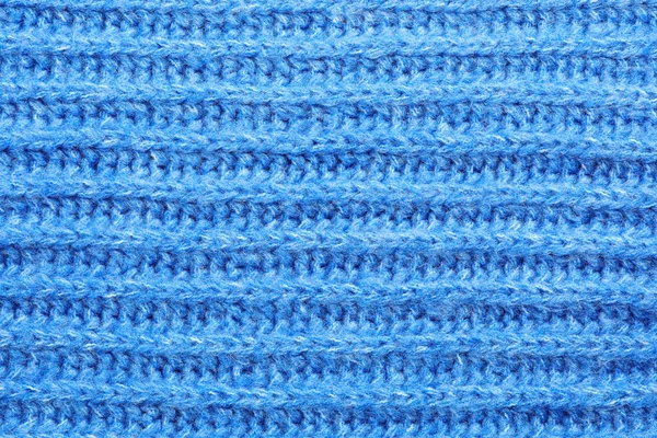 Arka plan olarak mavi kış süveteri, yakın görüş