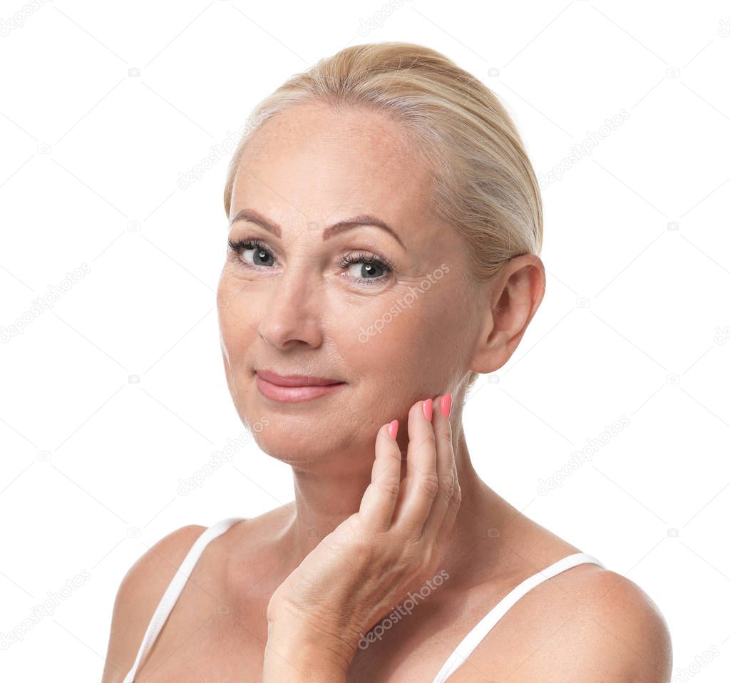 Portrait of beautiful mature woman with perfect skin on white background