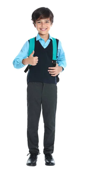 Glücklicher Junge in Schuluniform auf weißem Hintergrund — Stockfoto