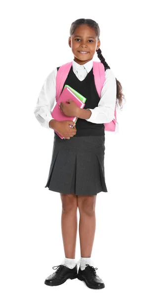 Menina afro-americana feliz em uniforme escolar no fundo branco — Fotografia de Stock