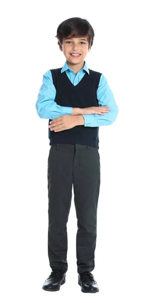 Menino feliz em uniforme escolar no fundo branco — Fotografia de Stock