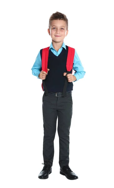 Menino feliz em uniforme escolar no fundo branco — Fotografia de Stock