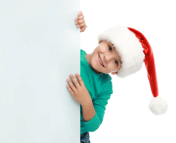 Criança bonita usando chapéu de Papai Noel no fundo branco. Natal feriado — Fotografia de Stock