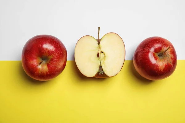 Composición plana con manzanas rojas jugosas maduras sobre fondo de color —  Fotos de Stock