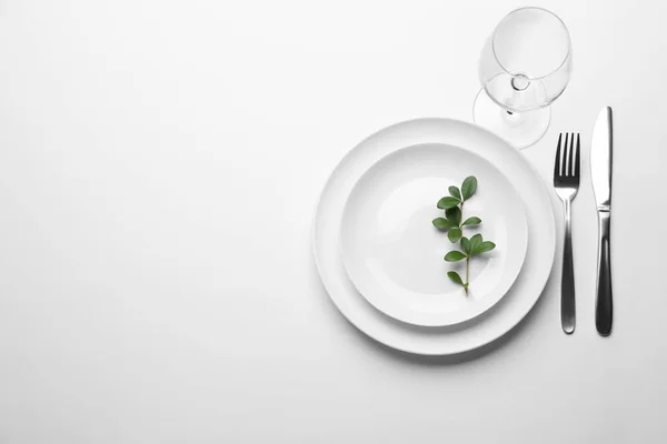 Elegant table setting on white background, top view — Stock Photo, Image