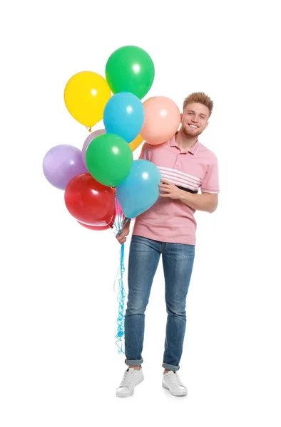 Jongeman met bos van kleurrijke ballonnen op witte achtergrond — Stockfoto
