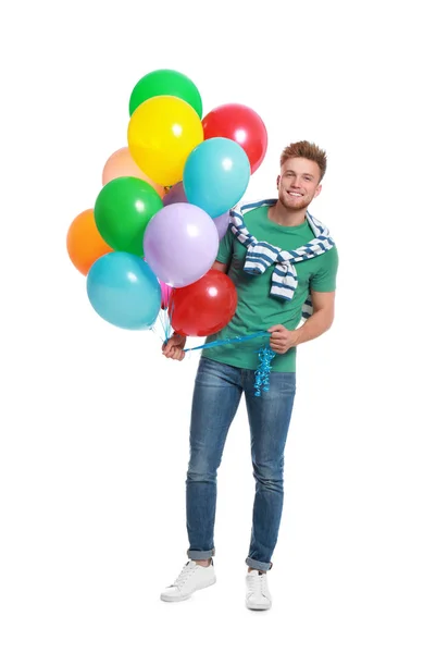 Young man holding bunch of colorful balloons on white background — Stock Photo, Image