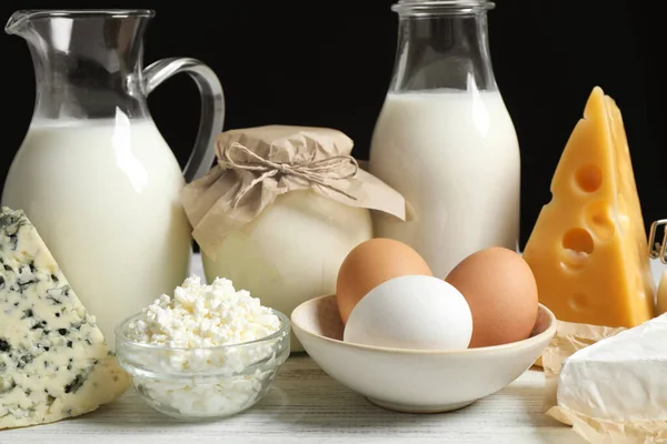 Different dairy products on white table, closeup