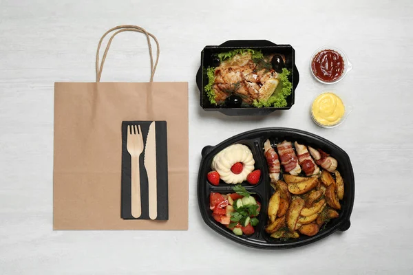 Flat lay composition with lunchboxes on white table. Healthy food delivery — Stock Photo, Image