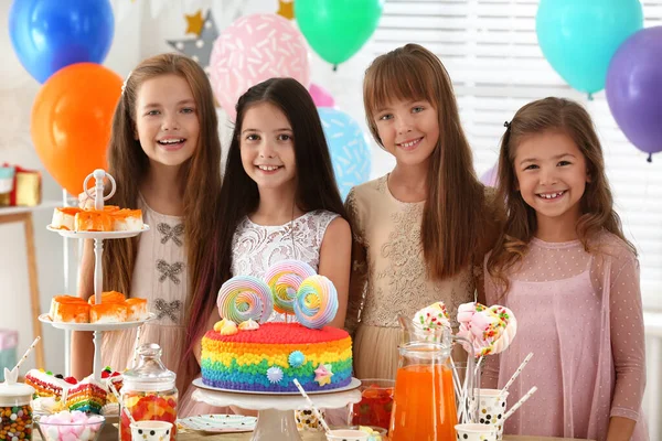 Happy children at birthday party in decorated room — Stock Photo, Image