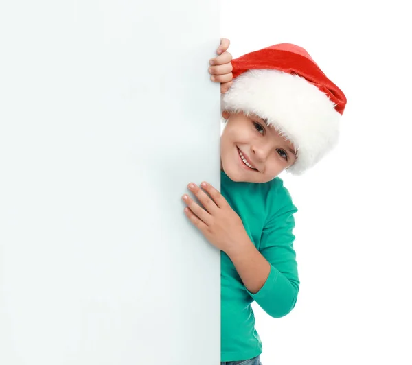 Criança bonita usando chapéu de Papai Noel no fundo branco. Natal feriado — Fotografia de Stock