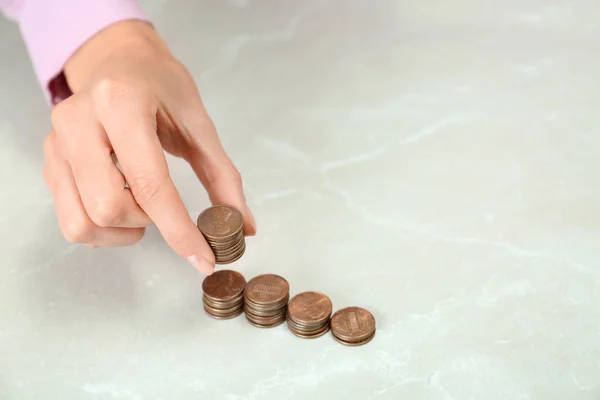 Woman counting coins at light table, closeup — Stock Photo, Image