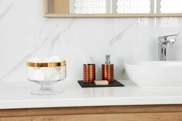 Jar with cotton pads on bathroom countertop — Stock Photo, Image