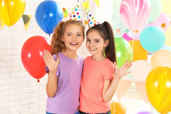 Happy children in room decorated for birthday party — Stock Photo, Image