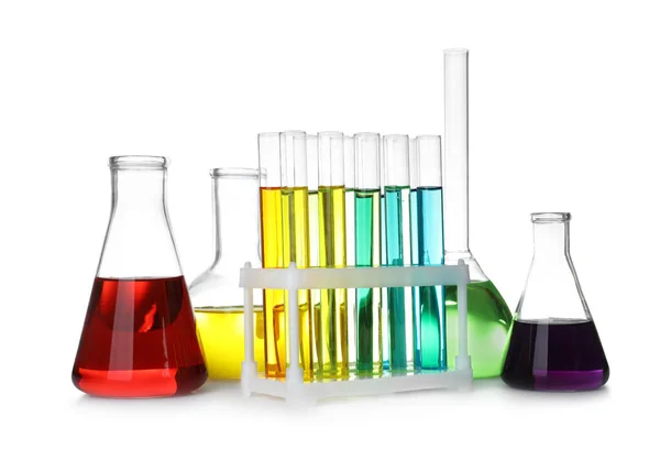 Laboratory glassware with color liquids on white background — Stock Photo, Image