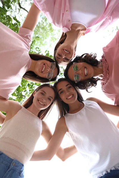 Happy women joined in circle outdoors, bottom view. Girl power concept — ストック写真