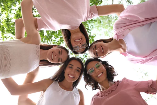 Happy women joined in circle outdoors, bottom view. Girl power concept — Stock Photo, Image