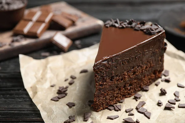 Delicious fresh chocolate cake on wooden table, closeup — Stock Photo, Image