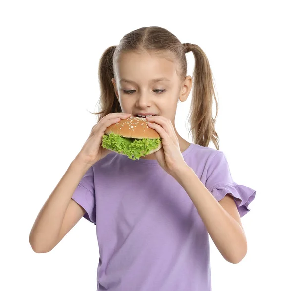 Menina feliz comendo sanduíche no fundo branco. Comida saudável para o almoço escolar — Fotografia de Stock