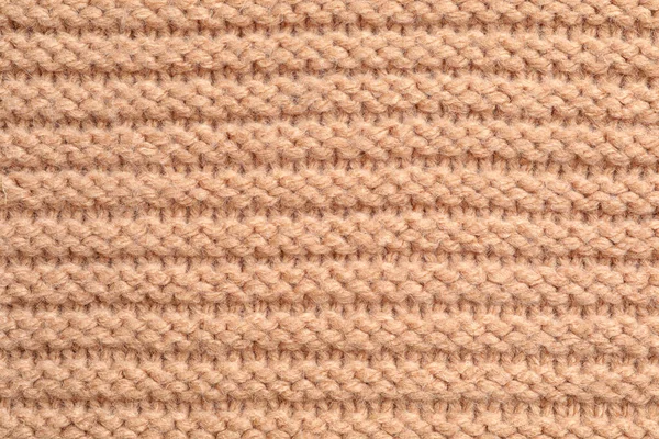 Beżowy zimowy sweter jako tło, widok z bliska — Zdjęcie stockowe