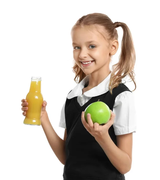 Happy girl holding apple and bottle of juice on white background. Healthy food for school lunch — Stock Photo, Image