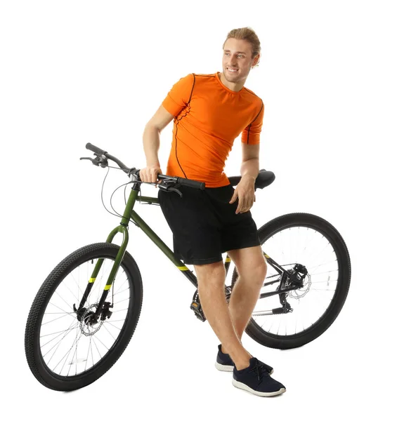 Junger Mann in Sportkleidung mit Fahrrad auf weißem Hintergrund — Stockfoto