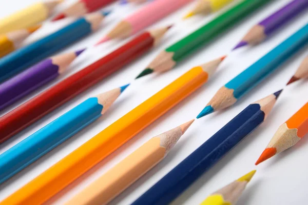 Composition with color pencils on white background, closeup — Stock Photo, Image